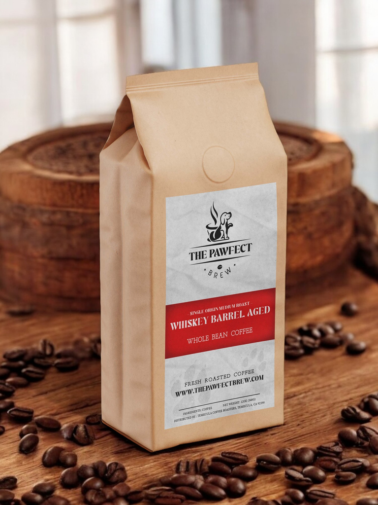 Whiskey barrel aged whole bean coffee bag surrounded by coffee beans